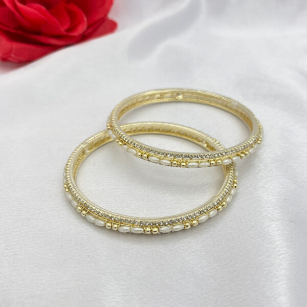 Elegant Gold Polish Oval Pearl & Zircon Bangles