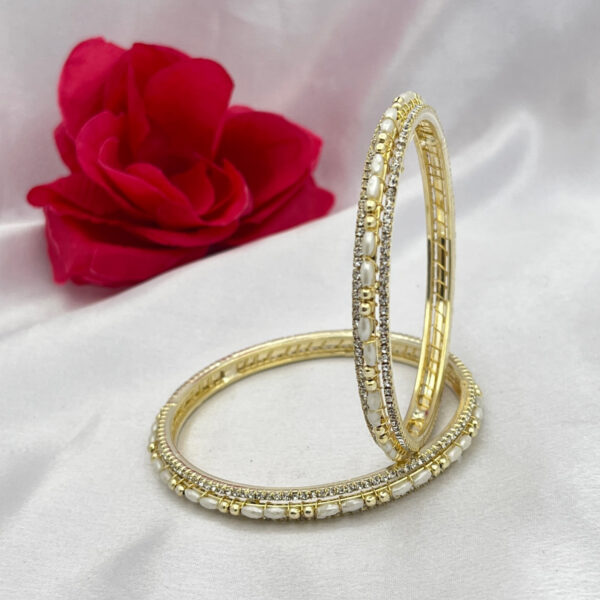 Elegant Gold Polish Oval Pearl & Zircon Bangles